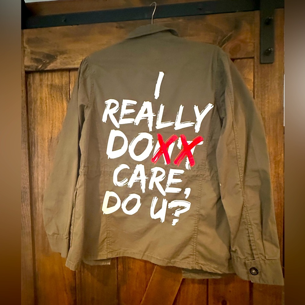 Olive Green Jacket with Bold White and Red Text